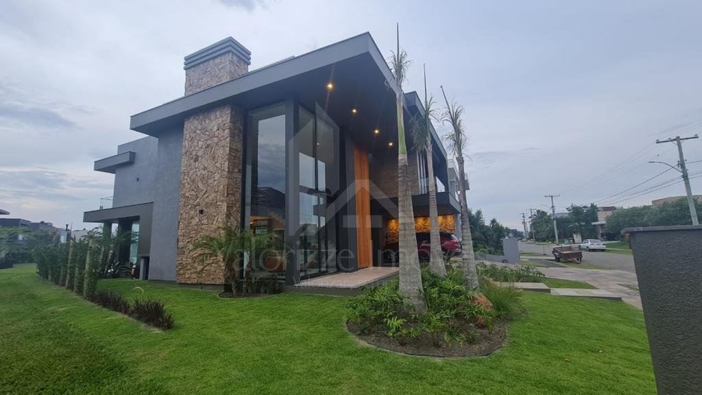 Casa em Condominio 5 dormitorios