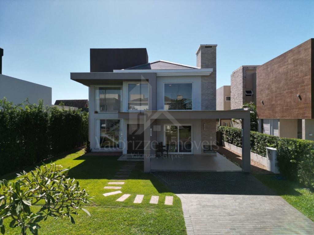 Casa em Condominio 5 dormitorios