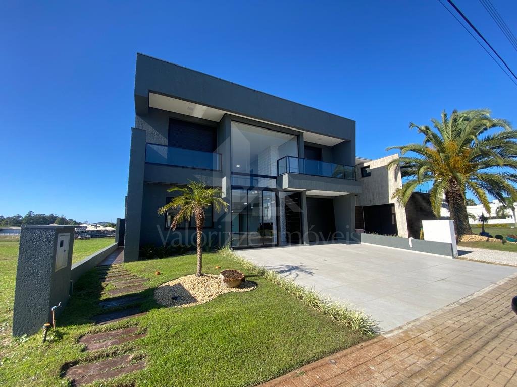 Casa em Condominio 5 dormitorios