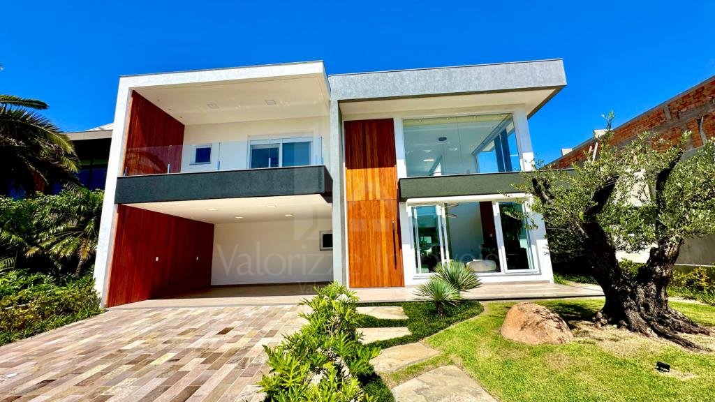 Casa em Condominio 5 dormitorios