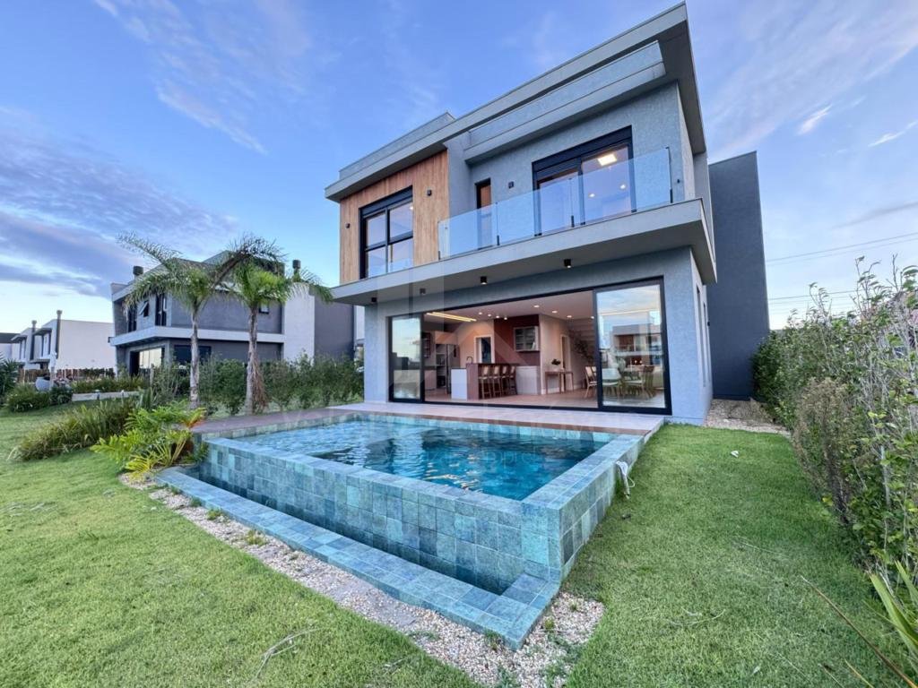 Casa em Condominio 5 dormitorios