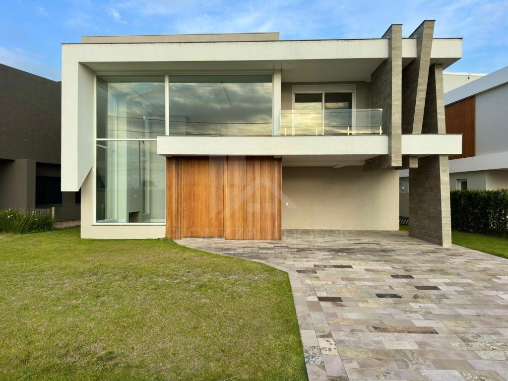 Casa em Condominio 5 dormitorios