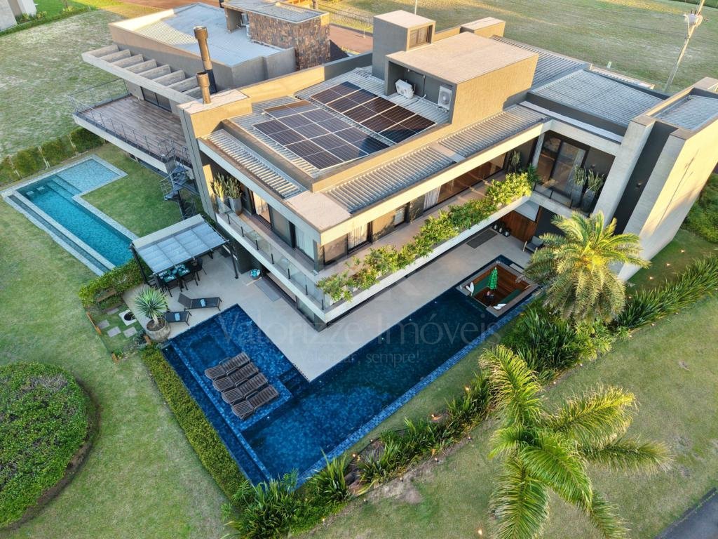 Casa em Condominio 5 dormitorios