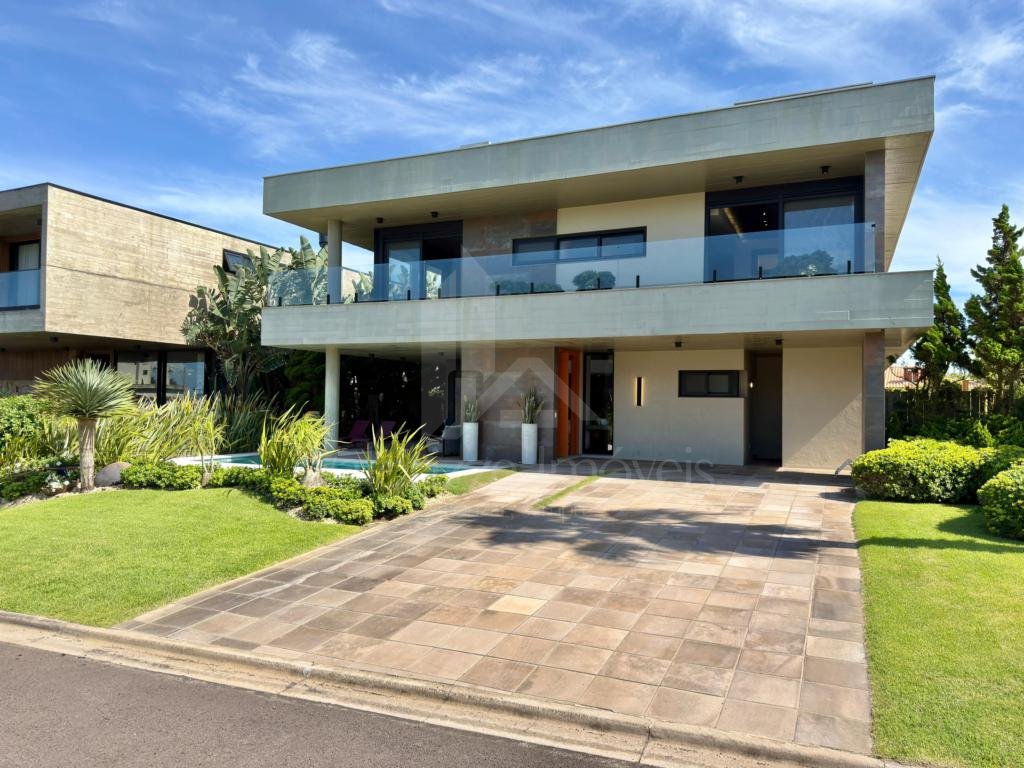 Casa em Condominio 5 dormitorios