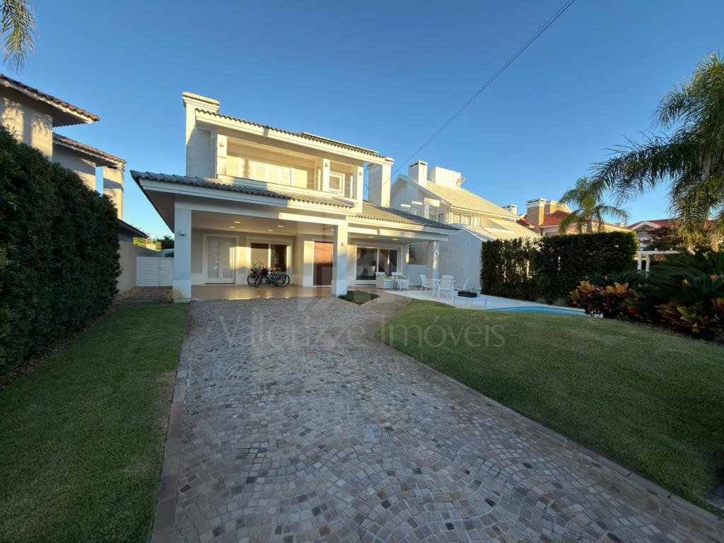 Casa em Condominio 5 dormitorios